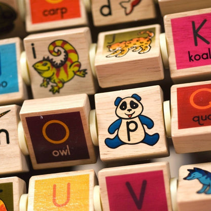 B. Toys Wooden Activity Cube - Zany Zoo: Educational Play with Animals, Spinners